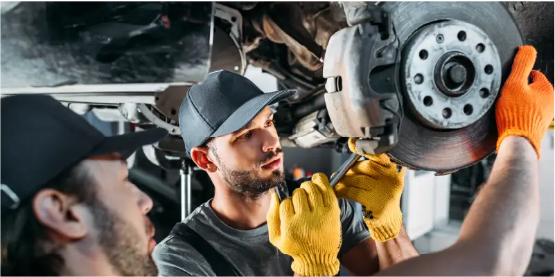 Image of mechanics repairing brake discs