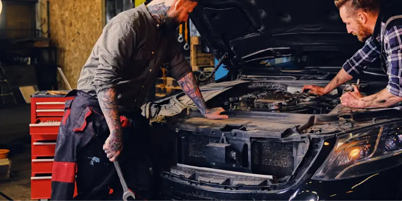 Image of mechanics working on a truck engine