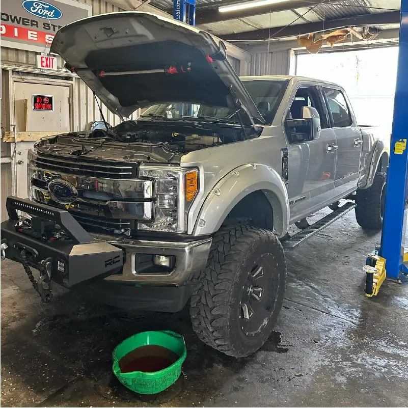 Image of truck having oil changed